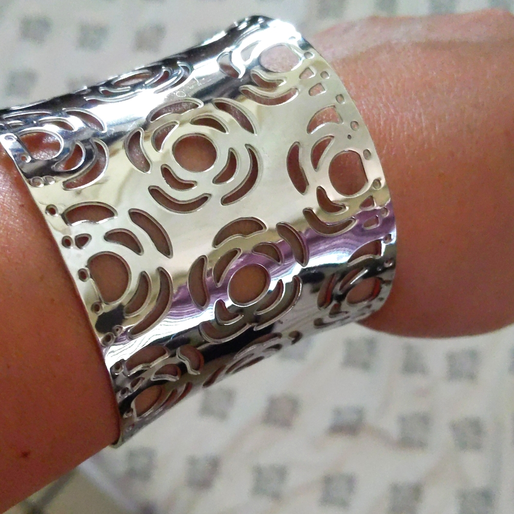 Silver color cuff with rose flower design, shiny, minimal scratch